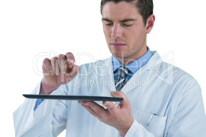 Doctor using a digital tablet against white background