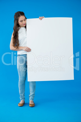 Woman holding a blank placard