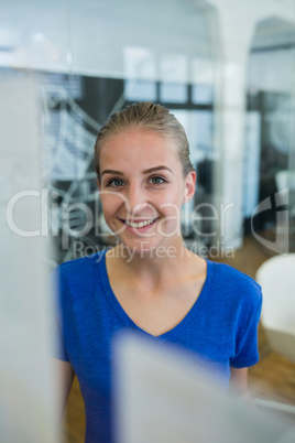 Female graphic designer smiling at camera