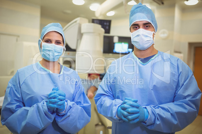 Portrait of surgeons standing in operation theater