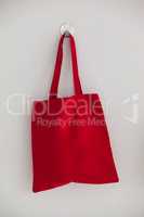 Red bag hanging on wall