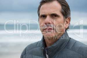 Portrait of serious man on beach