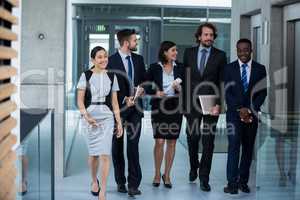 Businesswomen walking with colleagues