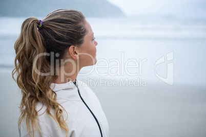 Close-up of thoughtful woman on beach