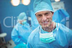 Portrait of male surgeon smiling in operation theater