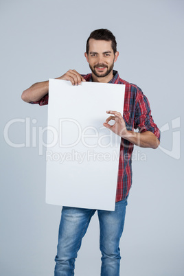 Man holding a blank placard