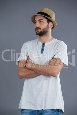 Man in white t-shirt and fedora hat