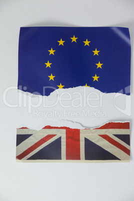 Half torn union jack and european union paper flag