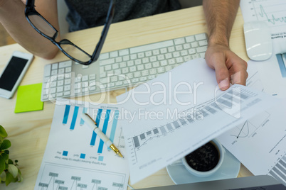 Graphic designer working at his desk