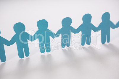 Row of blue paper cut-out figures