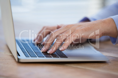 Female doctor working on her laptop