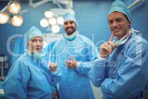 Portrait of surgeons standing in operation theater