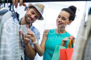Couple doing shopping at clothes store