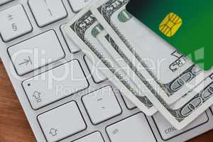 Smart card with currency notes on laptop