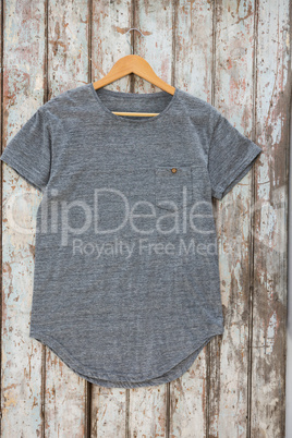 Grey t-shirt with pocket on hanger