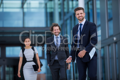 Businesswoman with colleagues walking