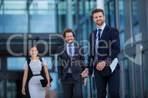 Businesswoman with colleagues walking