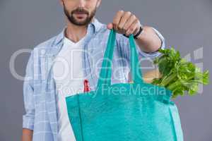 Man holding a grocery bag