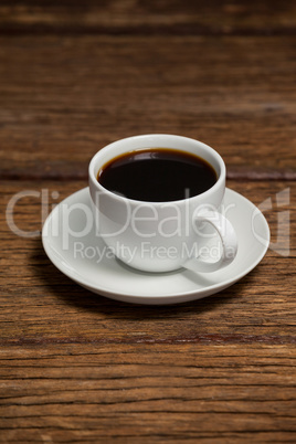 Cup of coffee on wooden table