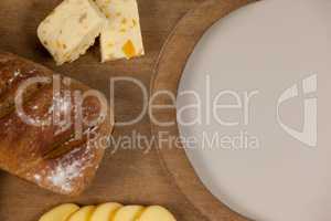 Cheese with bread on chopping board