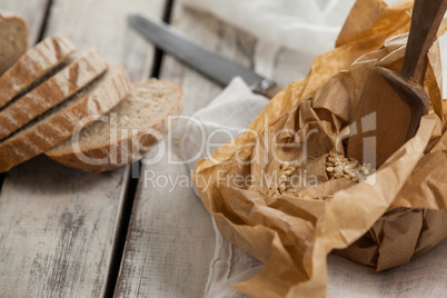 Sliced loaf of bread with knife