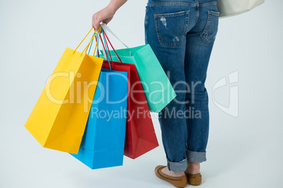 Woman carrying colorful shopping bags