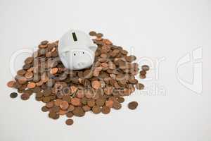 Piggy bank with stack of coins