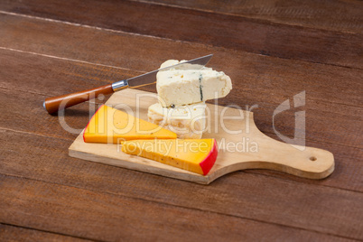 Slices of cheese with knife