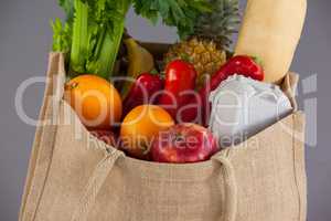 Vegetables and fruits in grocery bag