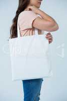 Beautiful woman carrying shopping bag