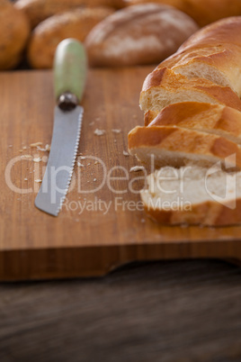 Sliced baguette with knife