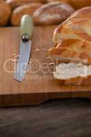 Sliced baguette with knife
