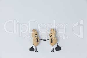 Figurine of two businessmen shaking hands