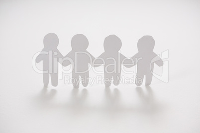 Row of paper cut-out figures