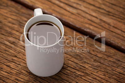 Cup of coffee on wooden table