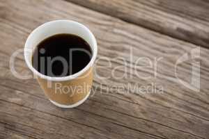 Cup of black coffee on wooden table