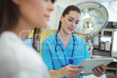 Female nurse using digital tablet