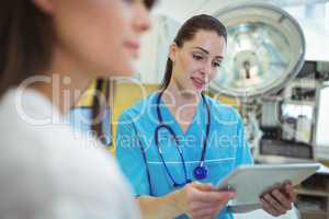 Female nurse using digital tablet
