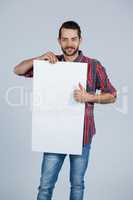 Man holding a blank placard