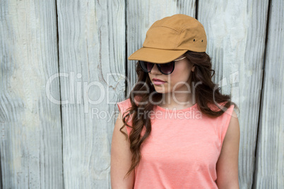 Woman in brown cap and sunglasses