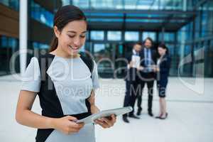 Businesswoman holding digital tablet