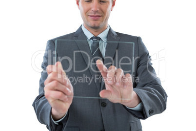 Businessman pretending to be using futuristic digital tablet