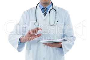 Male doctor using digital tablet