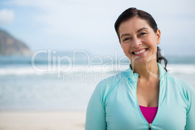 Portrait of smiling woman on beach