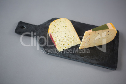 Slice of cheese on chopping board