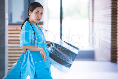 Nurse holding a X-ray report