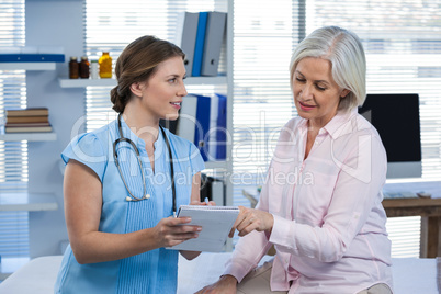 Doctor showing prescription to patient