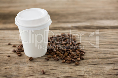 Coffee beans with disposable coffee cup