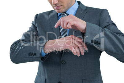 Businessman pretending to use a wrist watch