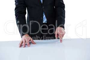 Businessman pretending to touch an invisible object